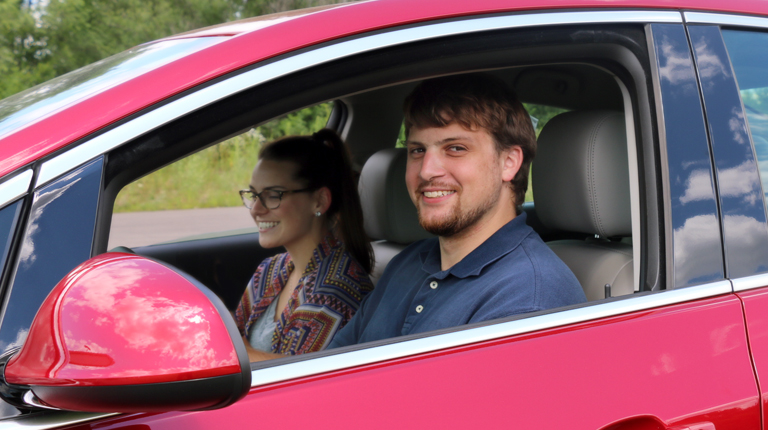 image of man driving loaner vehicle